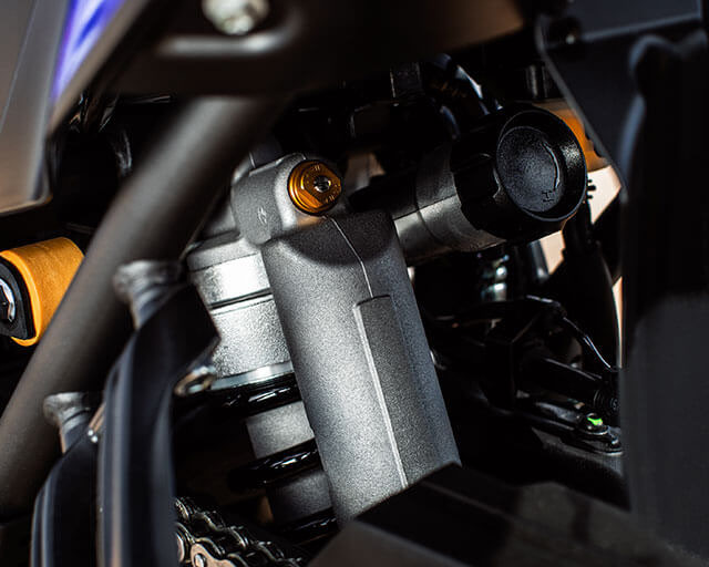 Remotely adjustable rear shock