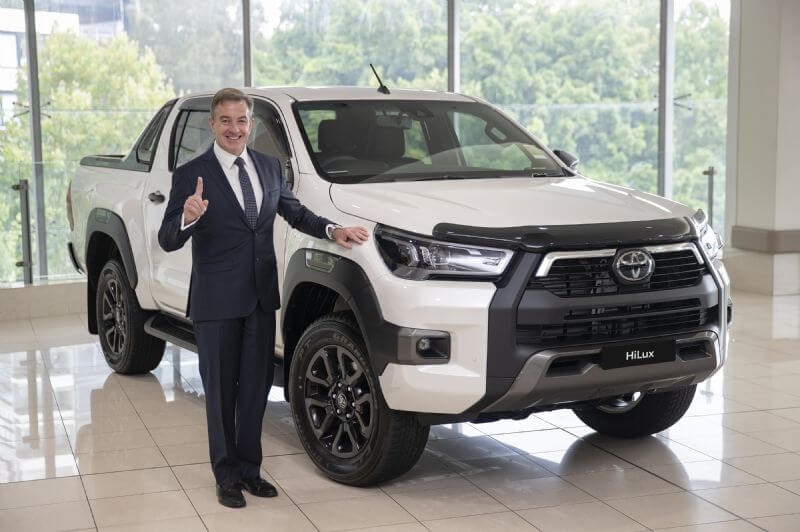 Toyota Australia President & CEO Matthew Callachor with Australia's top selling vehicle for 2020 Toyota HiLux. (Vehicle shown with optional extras)