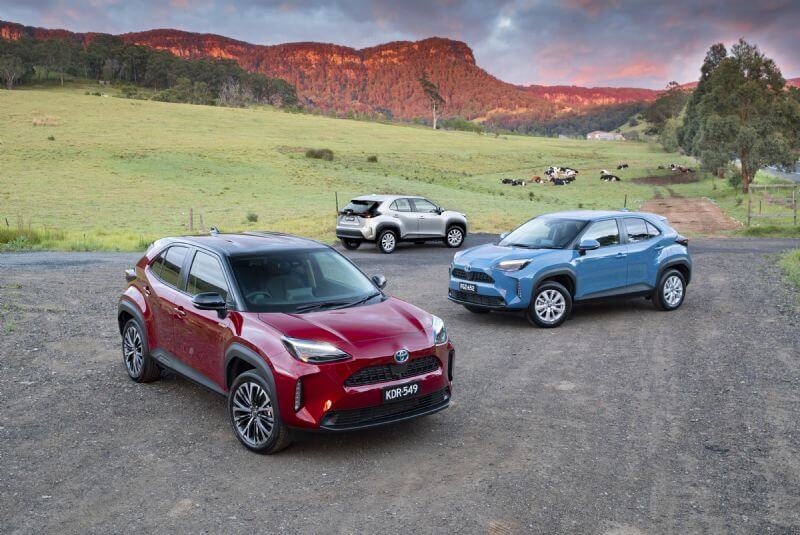 Toyota Yaris Cross Urban hybrid AWD with optional black roof (front), Toyota Yaris Cross GXL hybrid (middle), Toyota Yaris Cross GX petrol (rear)